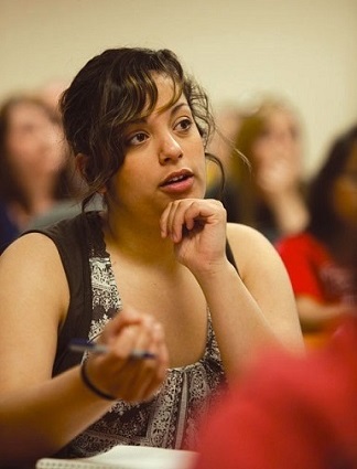 A student asking a question during a lecture.