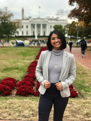 Kyra Solis smiling and posing in front of The White House in Washington, D.C.