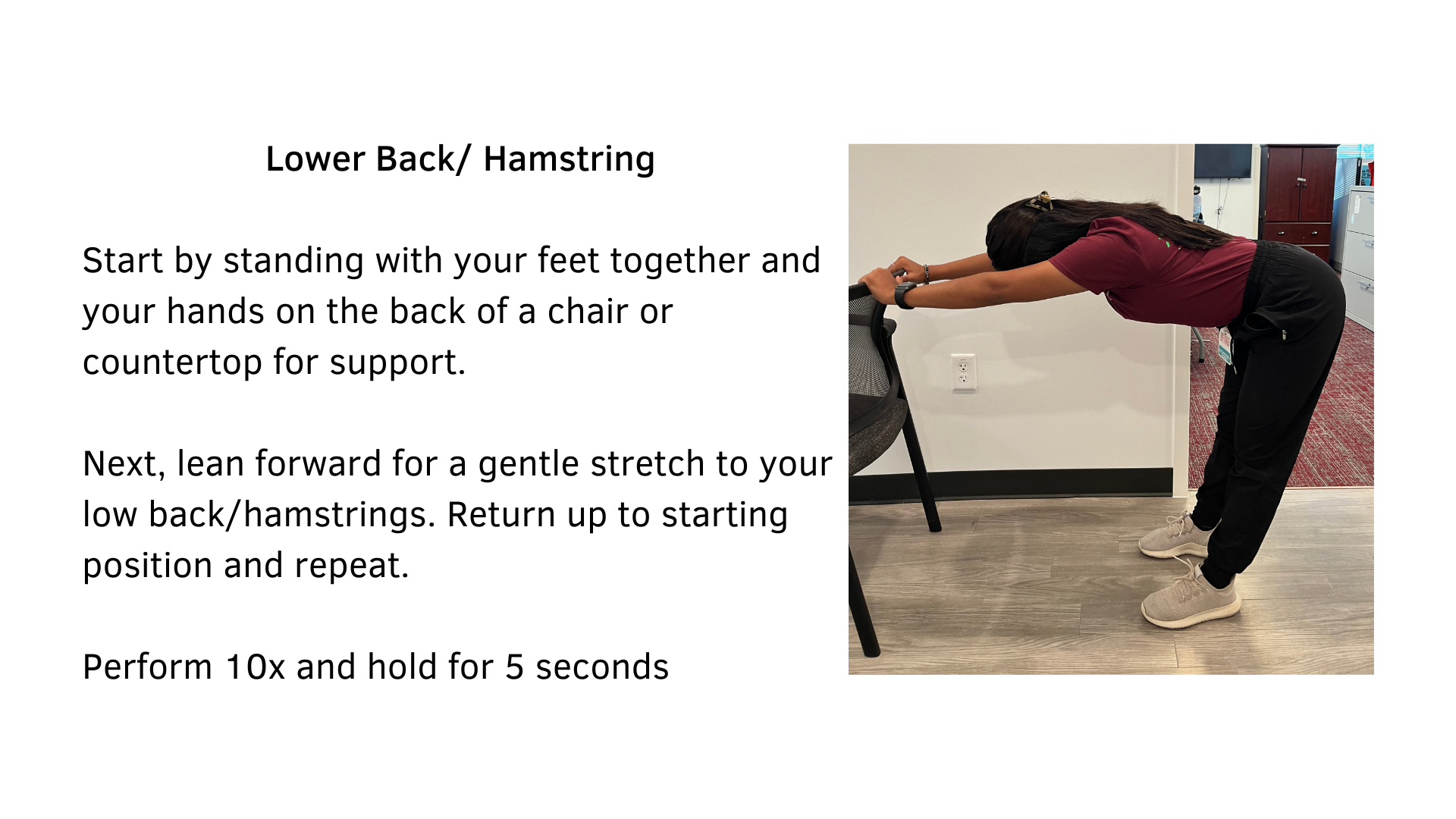 Black text on a white background that reads, "Lower Back/Hamstring: Start by standing with your feet together and your hands on the back of a chair or countertop for support. Next, lean forward for a gentle stretch to your low back/hamstrings. Return up to starting position and repeat. Perform 10x and hold for 5 seconds". Pictured is a woman performing the stretch using the back of a chair.