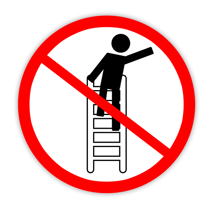 The "no" symbol with a figure on a ladder reaching over to the side.